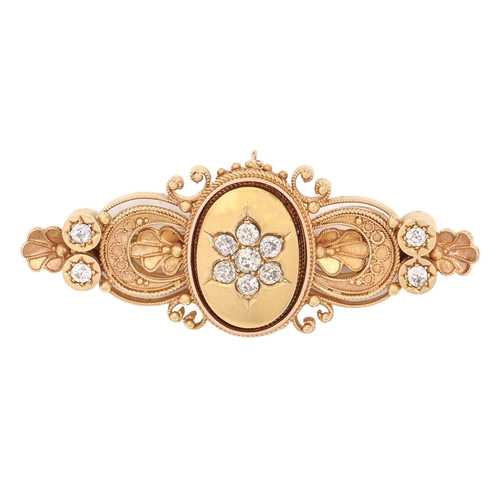 137 - A Victorian diamond brooch, in gold, with filigree border, 46mm l, 8.8g