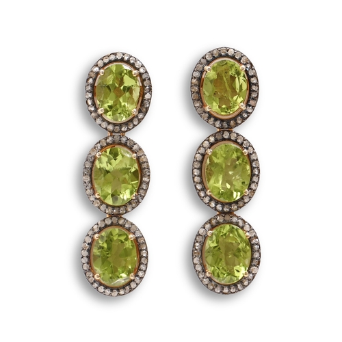169 - A pair of peridot and diamond triple cluster earrings, in silver gilt, fully articulated, 37mm h, 10... 