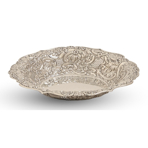312 - An Edwardian silver fruit dish, pierced with trellis and stamped with flowers and foliage, 26.5cm l,... 