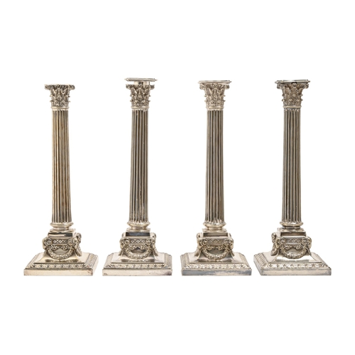 334 - A set of four Edwardian EPNS column candlesticks, 1901, three with nozzle, 31.5cm h, by Elkington &a... 