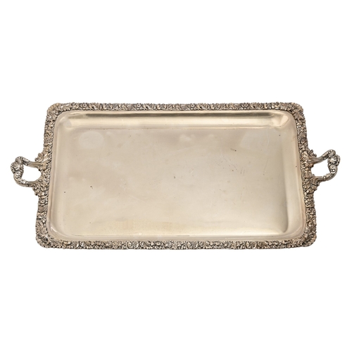 340 - A silver plated two-handled tea tray, early 20th c, the edge decorated with fruit, foliage and seash... 
