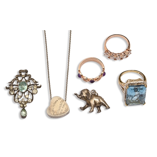 119 - Tiffany & Co. A silver heart pendant, 16mm h, maker's mark, a silver elephant charm, silver and ... 