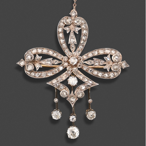 134 - A diamond brooch-pendant, late 19th c, of old cut diamonds, with three drops, mounted in silver and ... 