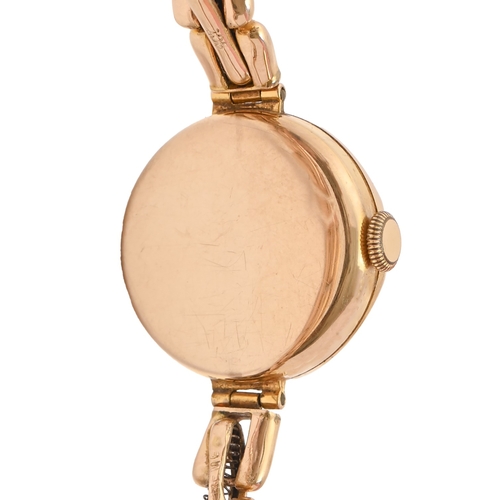 138 - A 9ct gold lady's wristwatch, 24mm diam, Chester 1931, on expanding gold bracelet, marked 9ct... 