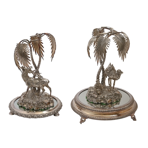 303 - Two Victorian orientalist cast EPNS and electrotype palm tree fruit stands, one with the figure of a... 