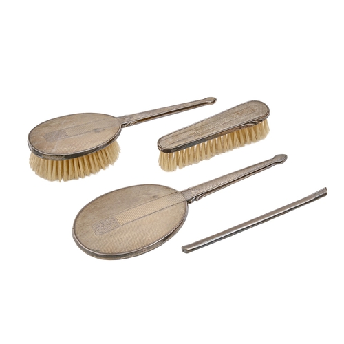 305 - An Elizabeth II silver brush set, engine turned, by W I Broadway & Co, Birmingham 1959, cased... 