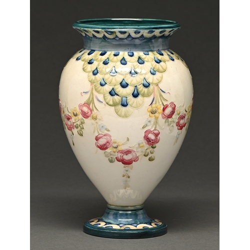 356 - William Moorcroft for James Macintyre & Co. A Florian style vase, c1908, slip trailed with swags... 