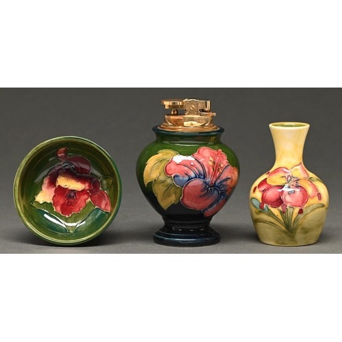 364 - A Moorcroft miniature African Lily on yellow vase, Orchid bowl and Hibiscus lighter, 1970s/80s, ligh... 