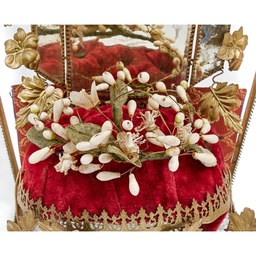 568 - A French globe&nbsp;de mari&eacute;e, 19th c, of buttoned red velvet, wax and wirework (bouquet), mi... 