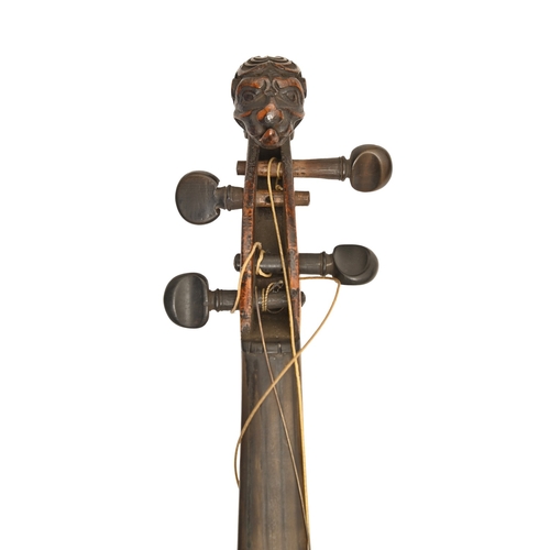603 - A bohemian violin, early 20th c, possibly from the  Schönbach group of makers, with a carved lion to... 