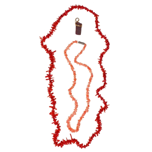 118 - A gold mounted hexagonal corundum (v. ruby) pendant, 30mm h and two coral necklaces (3)... 