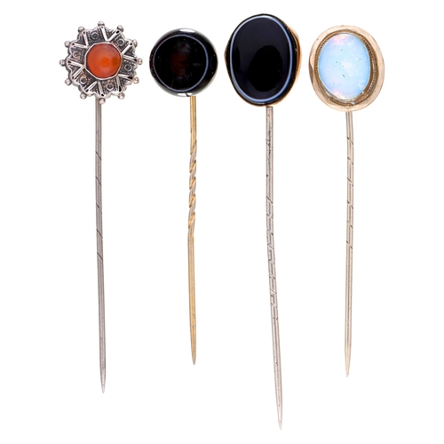 13 - Four Victorian stickpins, with banded agate, cornelian or opalescent glass terminal, mounted in silv... 