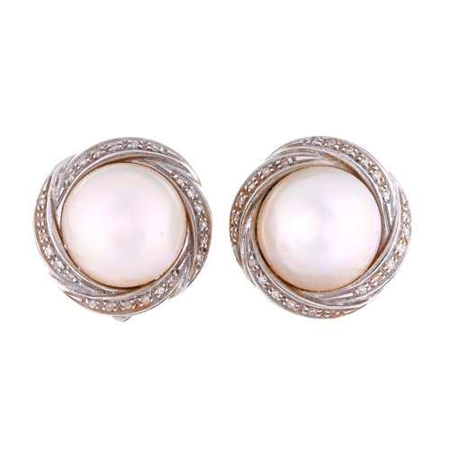 22 - A pair of cultured pearl and diamond earrings, in 18ct white gold, 19mm diam, import marked London 1... 