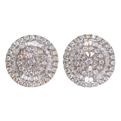 25 - A pair of diamond ear studs, in 18ct white gold, 9.5mm diam, part marked, 3.2g