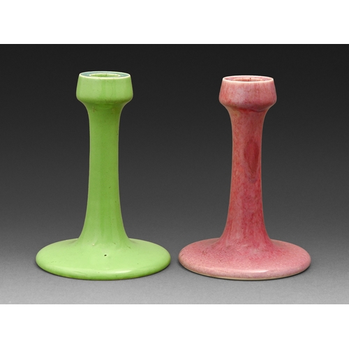 275 - Two Ruskin candlesticks, 1909, in green and mottled pink glaze, 17cm h, impressed oval mark and date... 