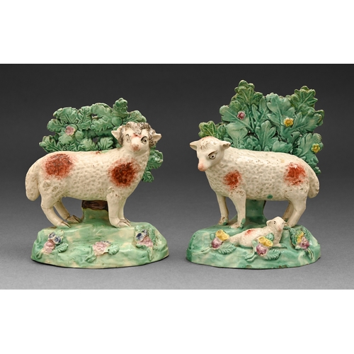 290 - A pair of Staffordshire pearlware models of a ewe and ram, c1820,&nbsp;before bocage, painted in ove... 