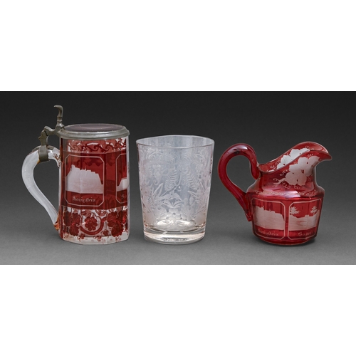 305 - A Bohemian ruby flashed glass jug and tankard, c1860, wheel engraved with named views, 13.5cm h and ... 