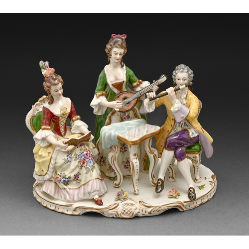 308 - A Volkstedt porcelain group of two musicians and a seated lady, first half 20th c, 22cm h, underglaz... 