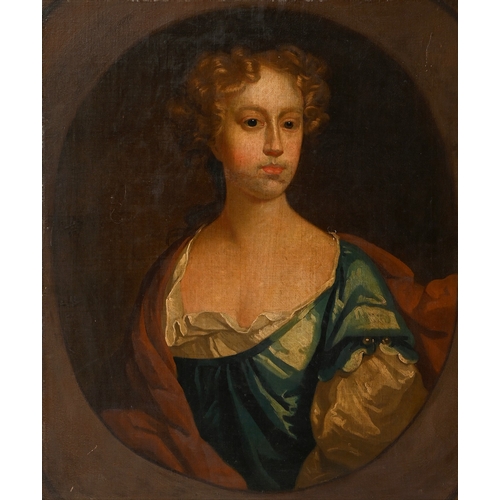 645 - Follower of Sir Godfrey Kneller - Portrait of a Lady, bust length in a blue dress with pearls, feign... 
