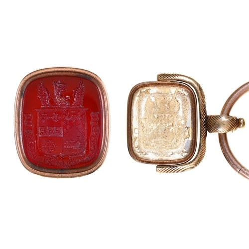 66 - Two Victorian gold fob seals, with cornelian or glass armorial intaglio and a Chinese silver sycee, ... 