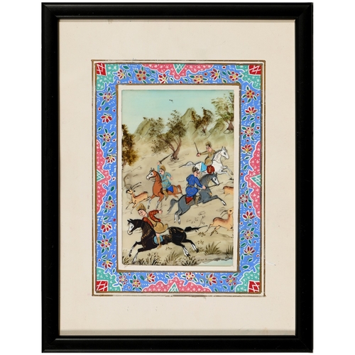 667 - An Indian illuminated leaf, 19th c, in the Mughal manner, centred by a dignitary on horseback, with ... 