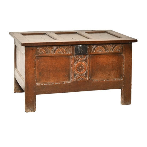 702 - A carved and panelled oak blanket chest, 18th c, the interior with a till, 64cm h; 115 x 52cm... 