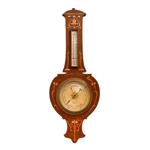 An Art Nouveau oak barometer, inlaid with copper and mother-of-pearl ...