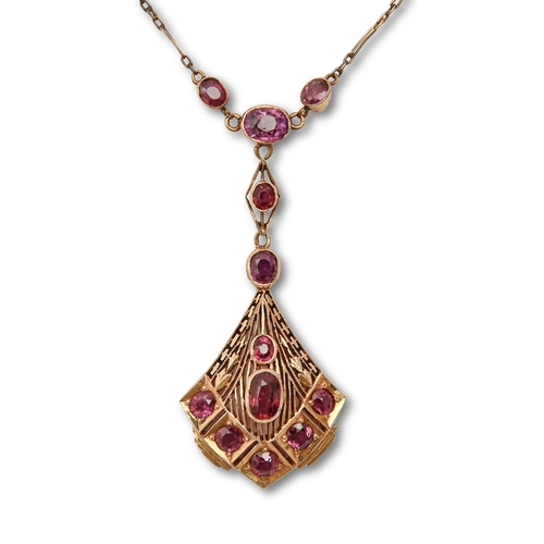 116 - A ruby necklet, in gold, fully articulated, 53mm h, marked 18K, sold with the original receipt of R.... 