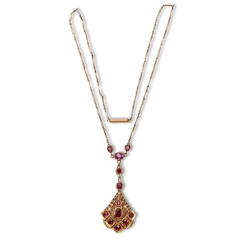 116 - A ruby necklet, in gold, fully articulated, 53mm h, marked 18K, sold with the original receipt of R.... 