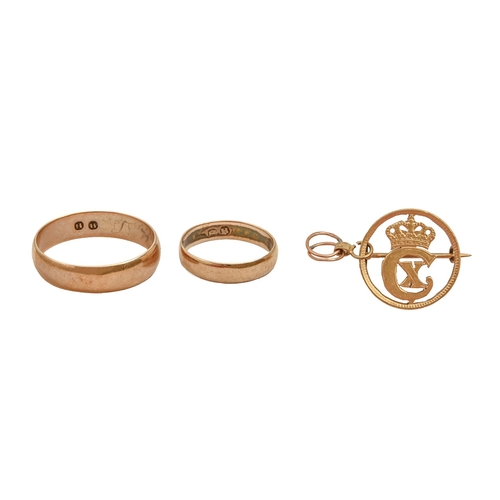 117 - Two gold coloured metal wedding rings, 5.9g and a Danish brooch in the form of a pierced coin, ring ... 