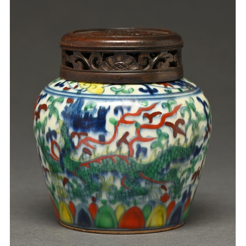 363 - A Chinese wucai dragon jar, painted in the typical palette under- and over-glaze, pierced and carved... 