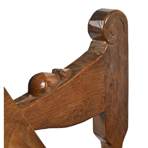 751 - Robert 'Mouseman' Thompson. An oak adjustable armchair, c1930s, with leather webbed seat, over-scrol... 