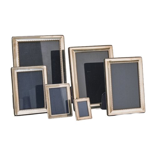 187 - Six Elizabeth II silver photograph frames, 23 x 18cm and smaller, maker R C in a pentagon, Sheffield... 