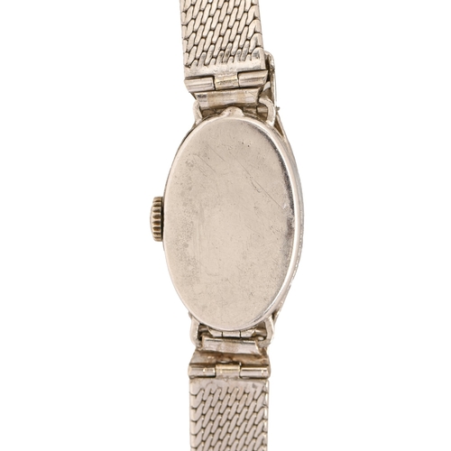 24 - An Art Deco diamond, onyx and platinum cocktail watch, with articulated lugs, 15 x 39mm, on later as... 