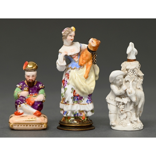 334 - A Continental porcelain figural scent bottle, in the form of a lady and a pug dog, late 19th c, moun... 