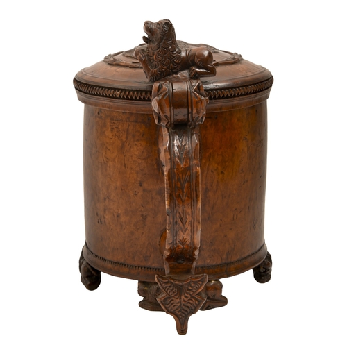 457 - A Norwegian burr birch peg tankard, dated 1780, of fine colour and patina, with carved lion lid, thu... 