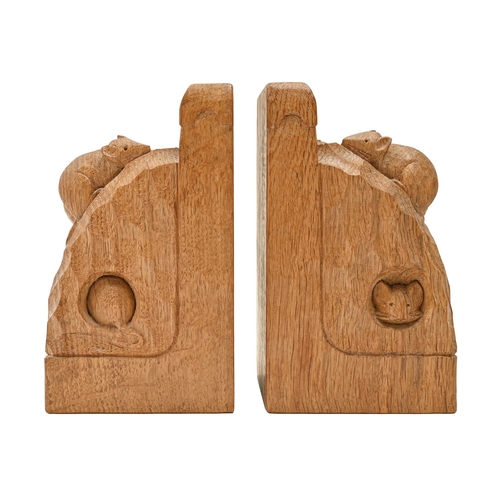 458 - A pair of Robert 'Mouseman' Thompson bookends, c1980, of adzed and carved oak, with three mice, one ... 