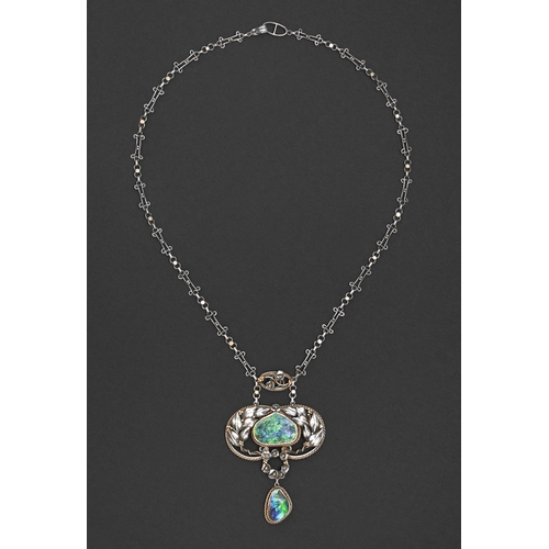 48 - An Arts & Crafts black opal and silver pendant, early 20th c, the larger peach shaped opal encir... 