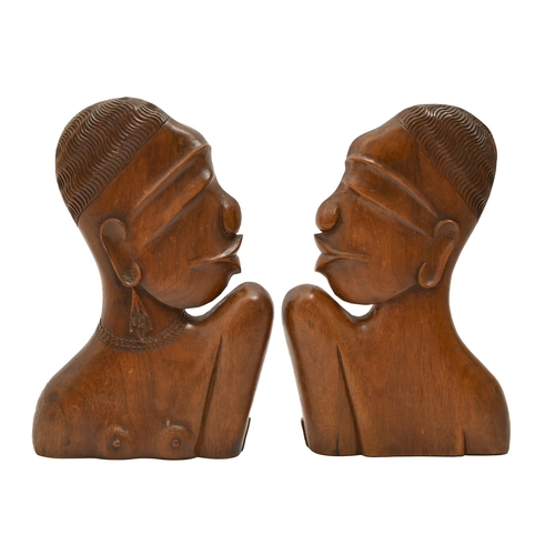 484 - A pair of Art Deco carved hardwood busts, in the manner of&nbsp;Karl Hagenauer, c 1930,&nbsp;as prof... 