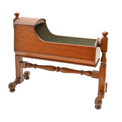 497 - Miniature furniture. A Victorian stained and varnished pine doll's cradle, the interior retaining th... 
