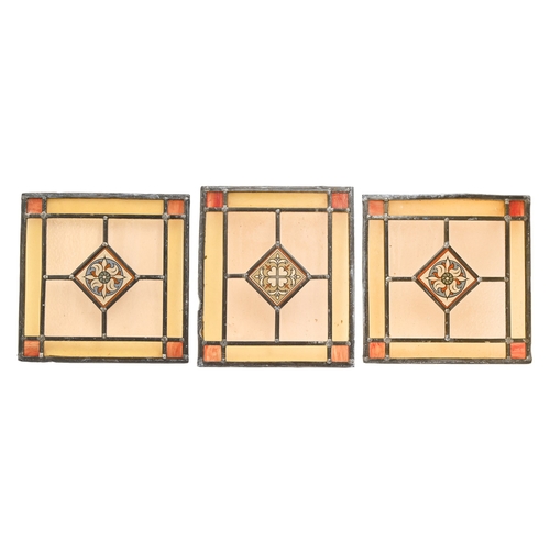 519 - A set of four stained and leaded glass window lights, early 19th c, 48 x 53cm and a smaller contempo... 
