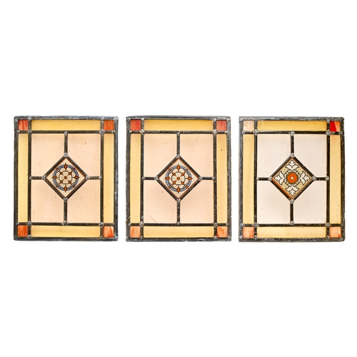 519 - A set of four stained and leaded glass window lights, early 19th c, 48 x 53cm and a smaller contempo... 