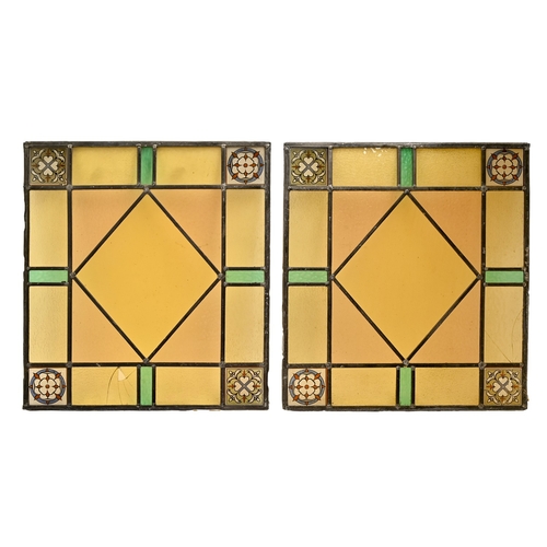 519 - A set of four stained and leaded glass window lights, early 19th c, 48 x 53cm and a smaller contempo... 