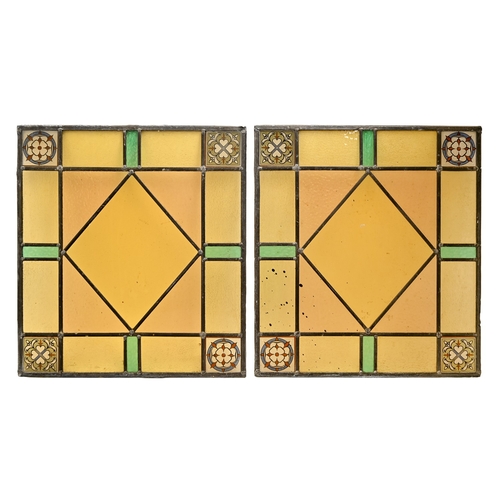 519 - A set of four stained and leaded glass window lights, early 19th c, 48 x 53cm and a smaller contempo... 