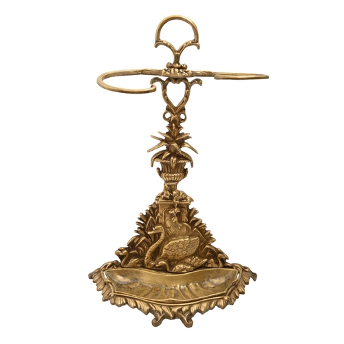 522 - An ornate brass stick stand, early 20th c, with a swan and cygnet, mounted by a vase of flowers, 64c... 
