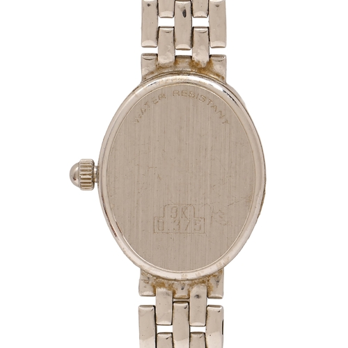 54 - An oval 9ct white gold lady's wristwatch, quartz movement, 20mm, on 9ct white gold bracelet, 15.5g... 