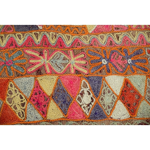 An Iraqi embroidered rug, 153 x 253cm