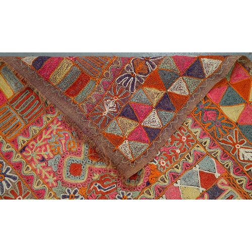 An Iraqi embroidered rug, 153 x 253cm