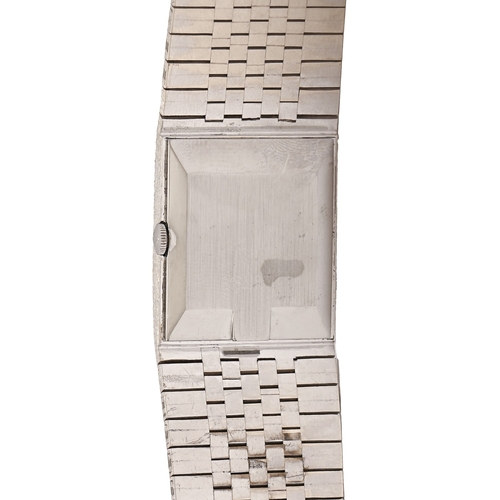 83 - A Universal white gold rectangular wristwatch, mechanical movement, 24 x 33mm, on maker’s integral t... 