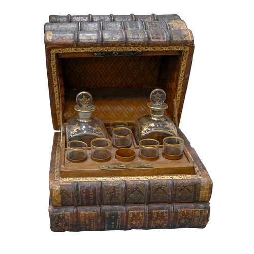 541 - A French liqueur set, the case formed from antique French gilt tooled leather bound books, with a pa... 